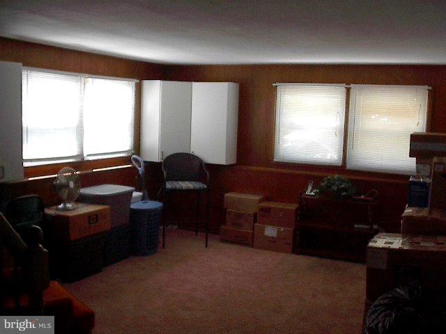 6002 Chesworth Road Baltimore, MD 21228 - Photo 14 of 26 a living room with furniture and a window