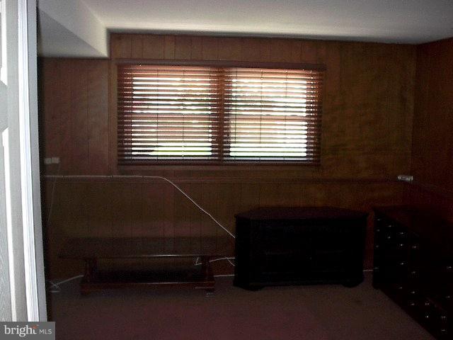 6002 Chesworth Road Baltimore, MD 21228 - Photo 15 of 26 a room that has a bed and a window