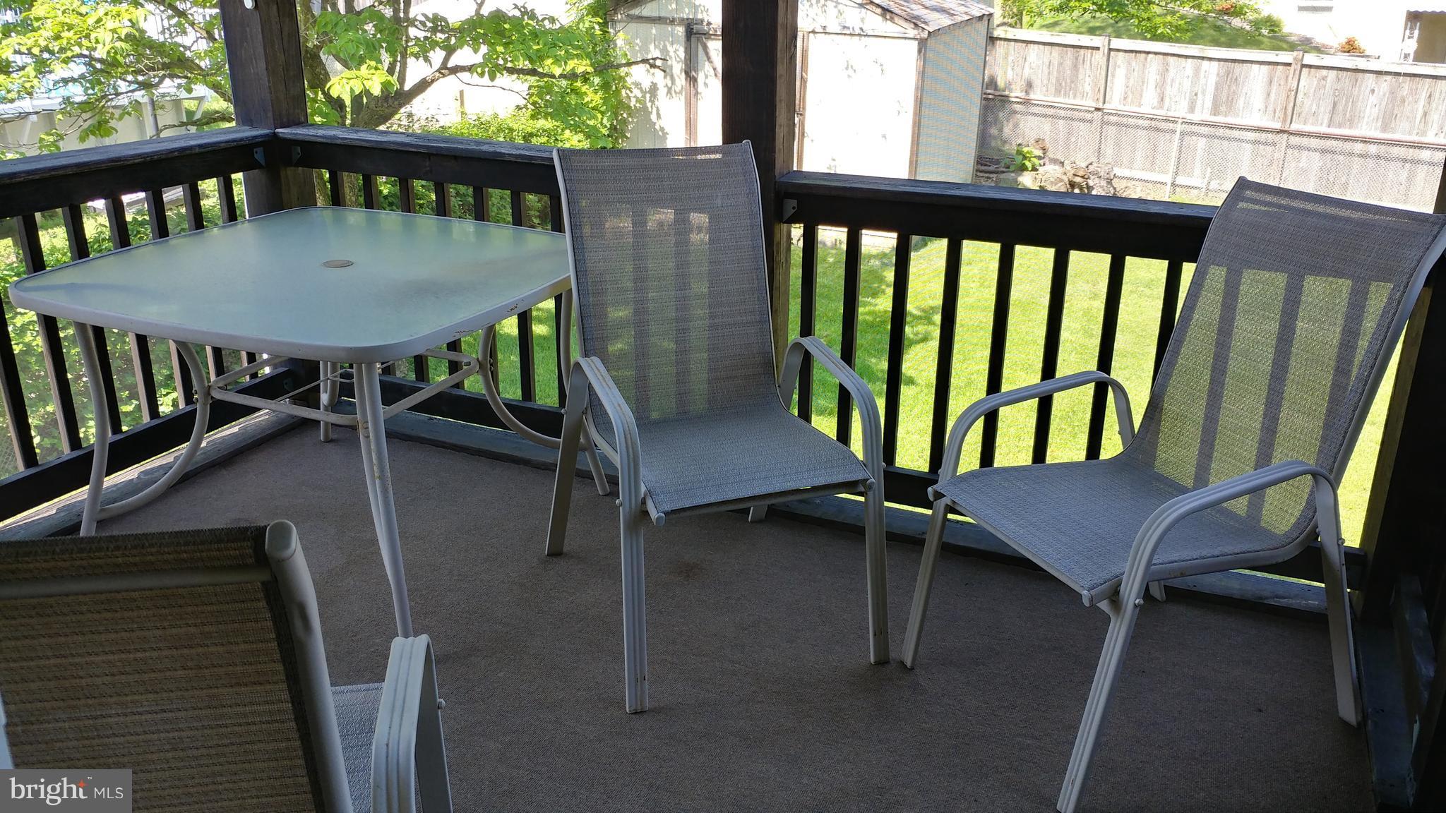 6002 Chesworth Road Baltimore, MD 21228 - Photo 22 of 26 a view of a balcony with chairs