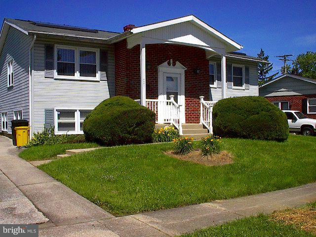 6002 Chesworth Road Baltimore, MD 21228 - Photo 25 of 26 a front view of a house with a yard