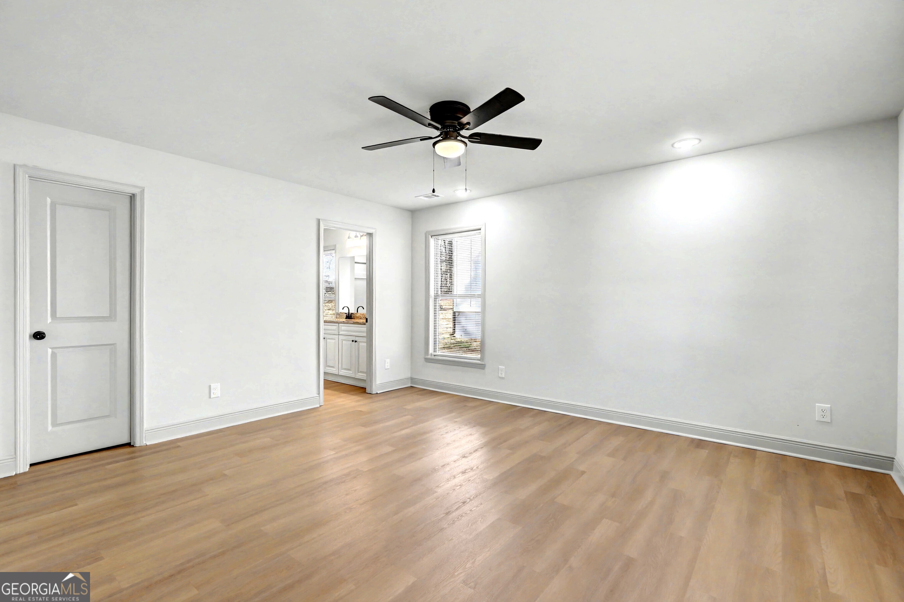 411 Loblolly Ridge Locust Grove, GA 30248 - Photo 11 of 43 a view of an empty room with a window
