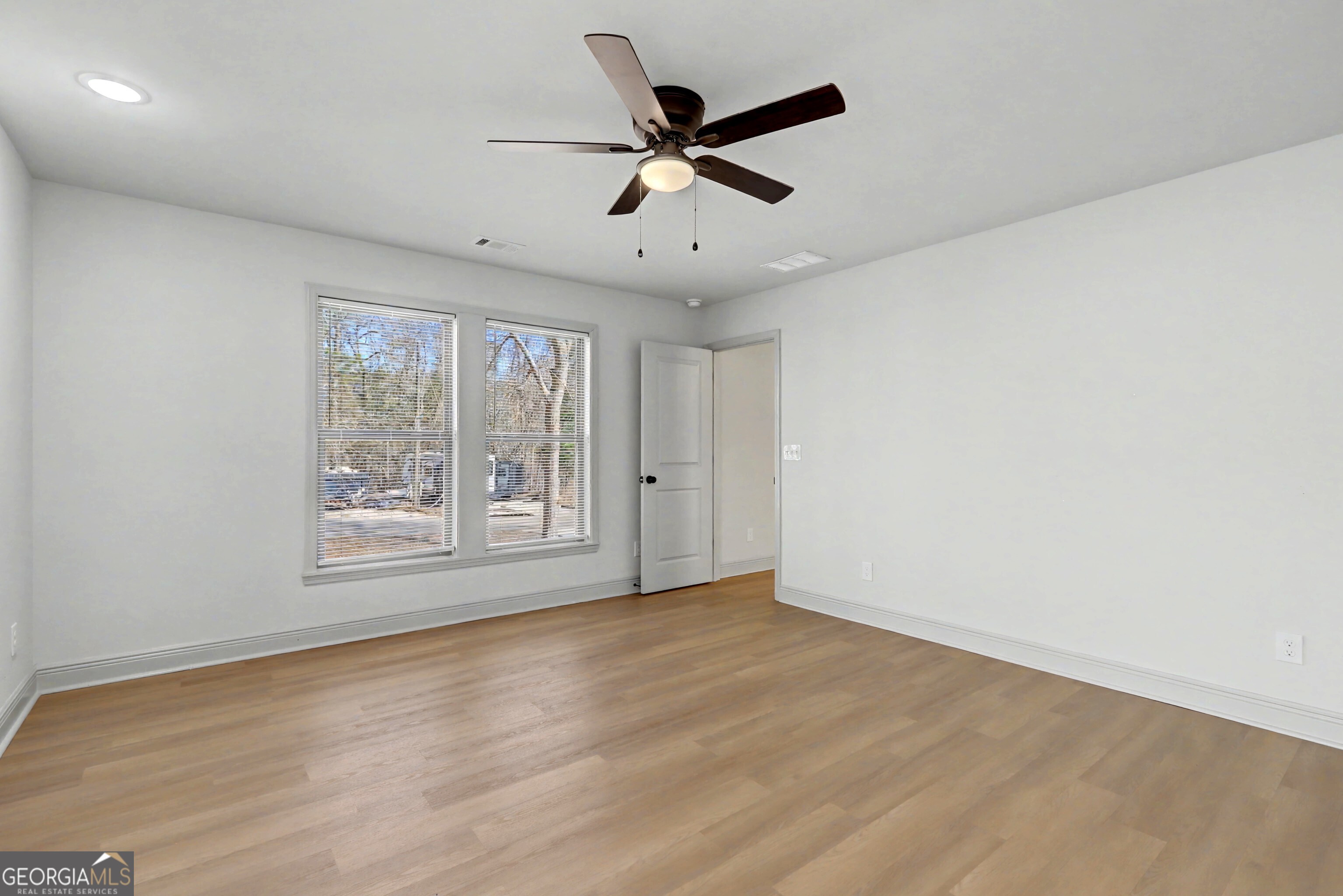 411 Loblolly Ridge Locust Grove, GA 30248 - Photo 13 of 43 a view of an empty room with a window
