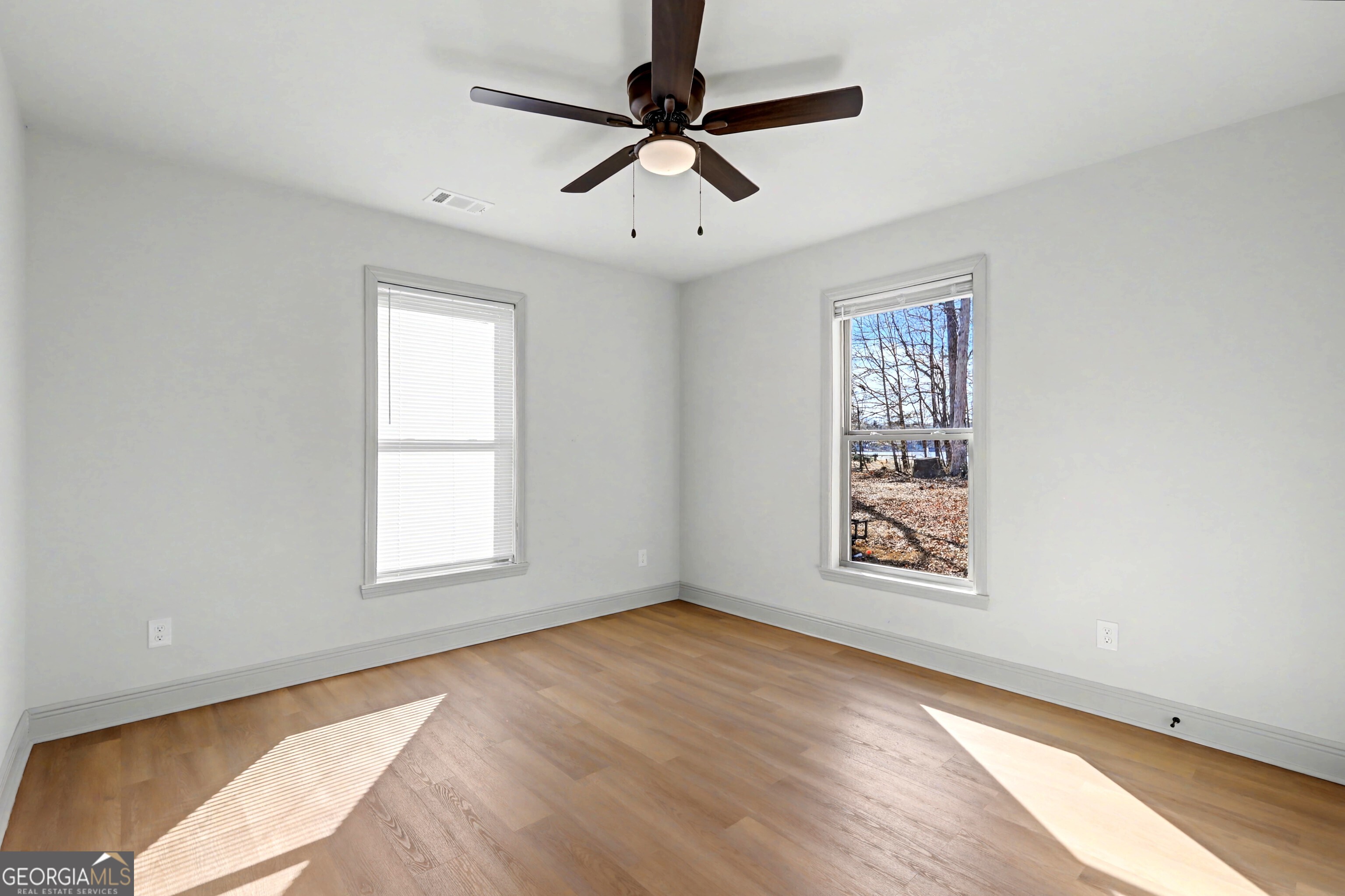 411 Loblolly Ridge Locust Grove, GA 30248 - Photo 21 of 43 an empty room with windows and fan
