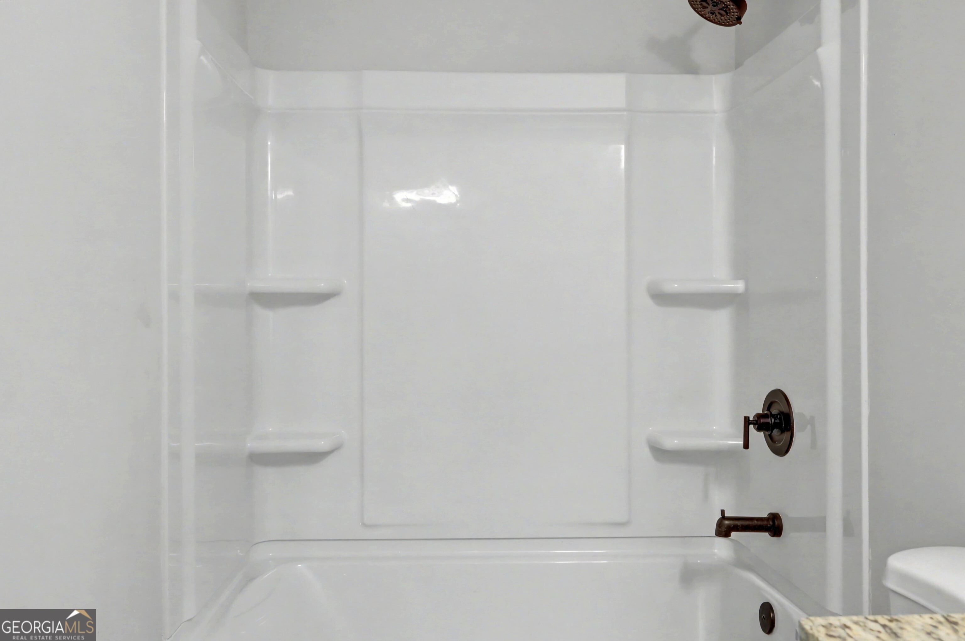 411 Loblolly Ridge Locust Grove, GA 30248 - Photo 25 of 43 a bathroom with a shower