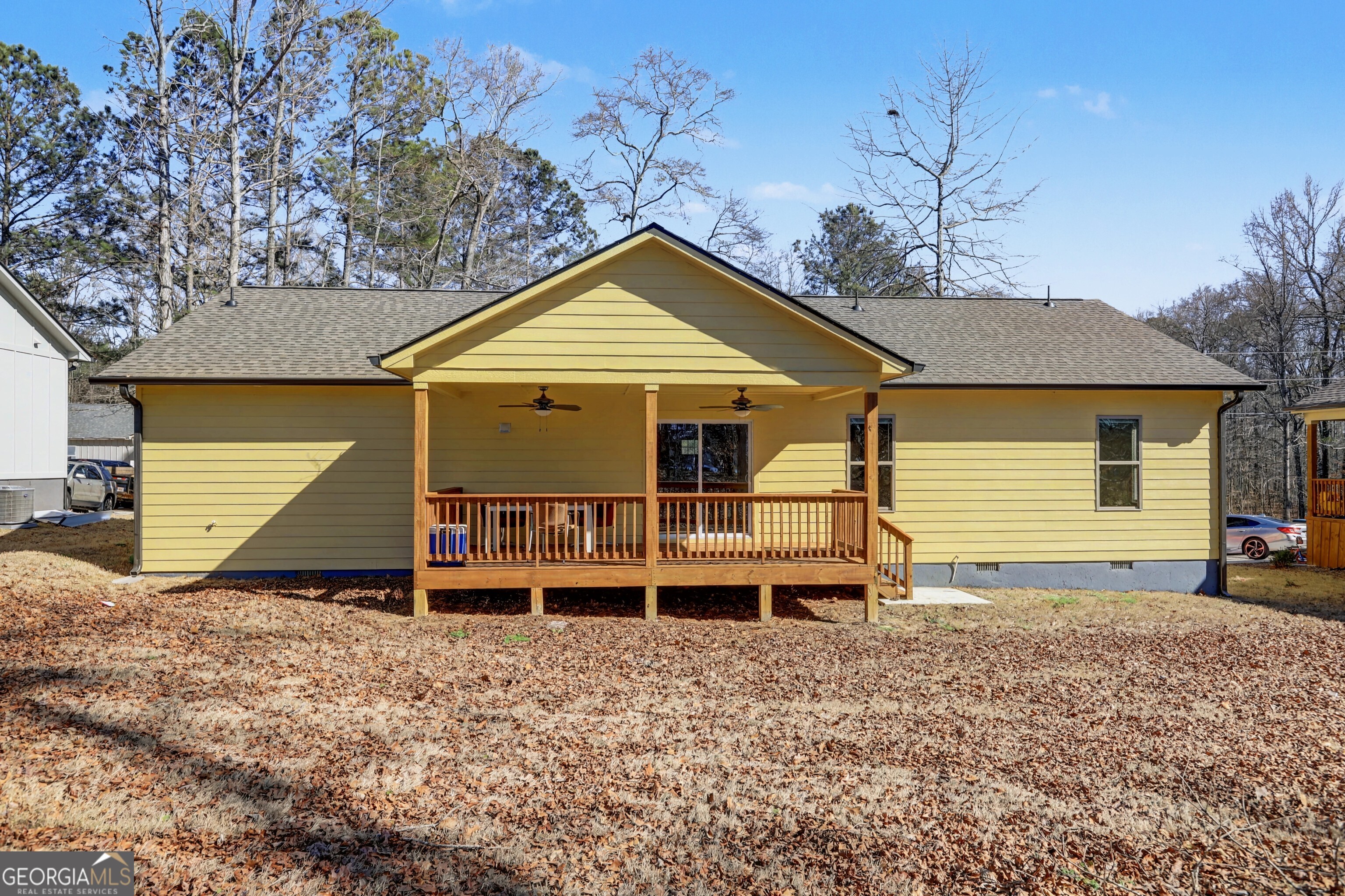 411 Loblolly Ridge Locust Grove, GA 30248 - Photo 30 of 43 a view of a house with a yard and wooden fence