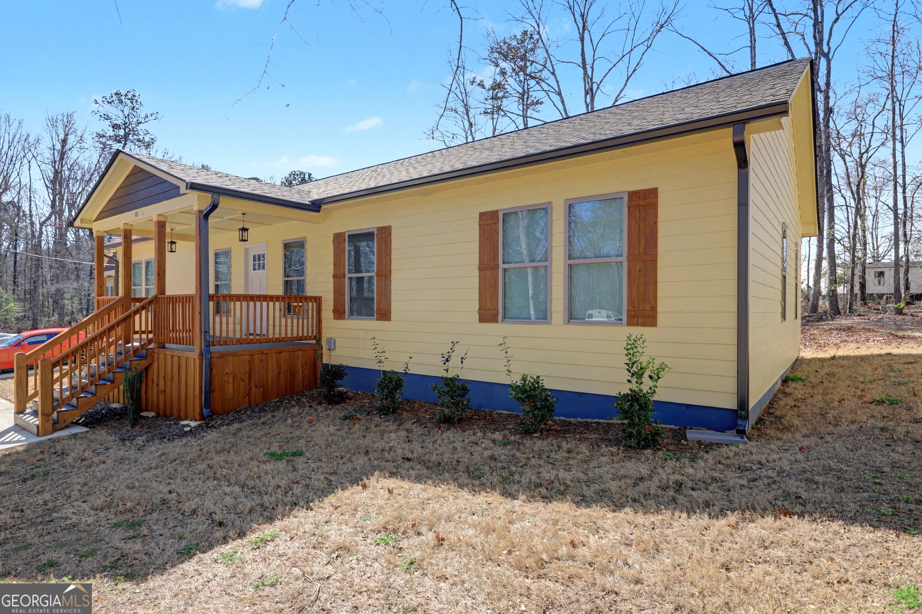 411 Loblolly Ridge Locust Grove, GA 30248 - Photo 31 of 43 a front view of a house with a yard