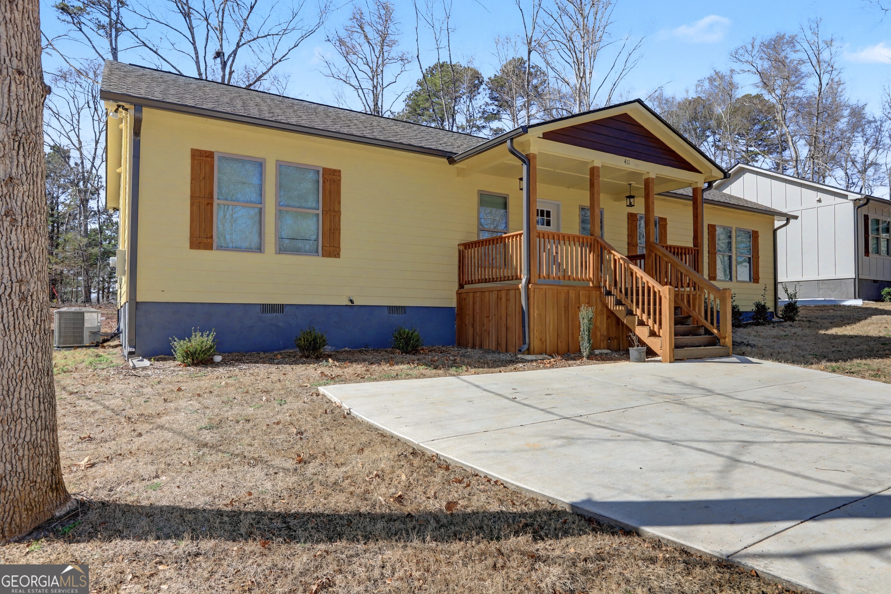 411 Loblolly Ridge Locust Grove, GA 30248 - Photo 32 of 43 a front view of a house with a yard