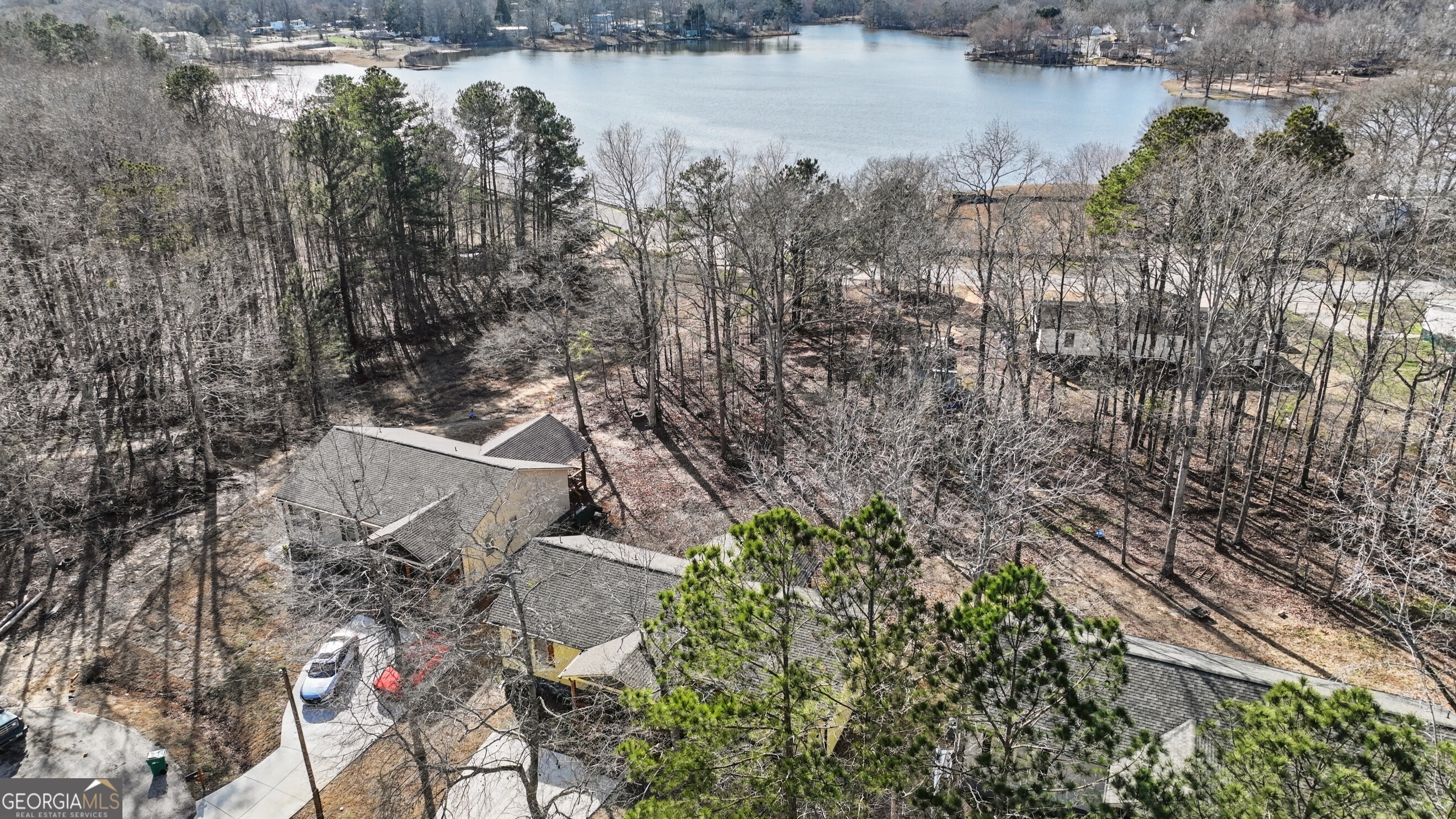411 Loblolly Ridge Locust Grove, GA 30248 - Photo 36 of 43 a bird view of house with outdoor space and lake view