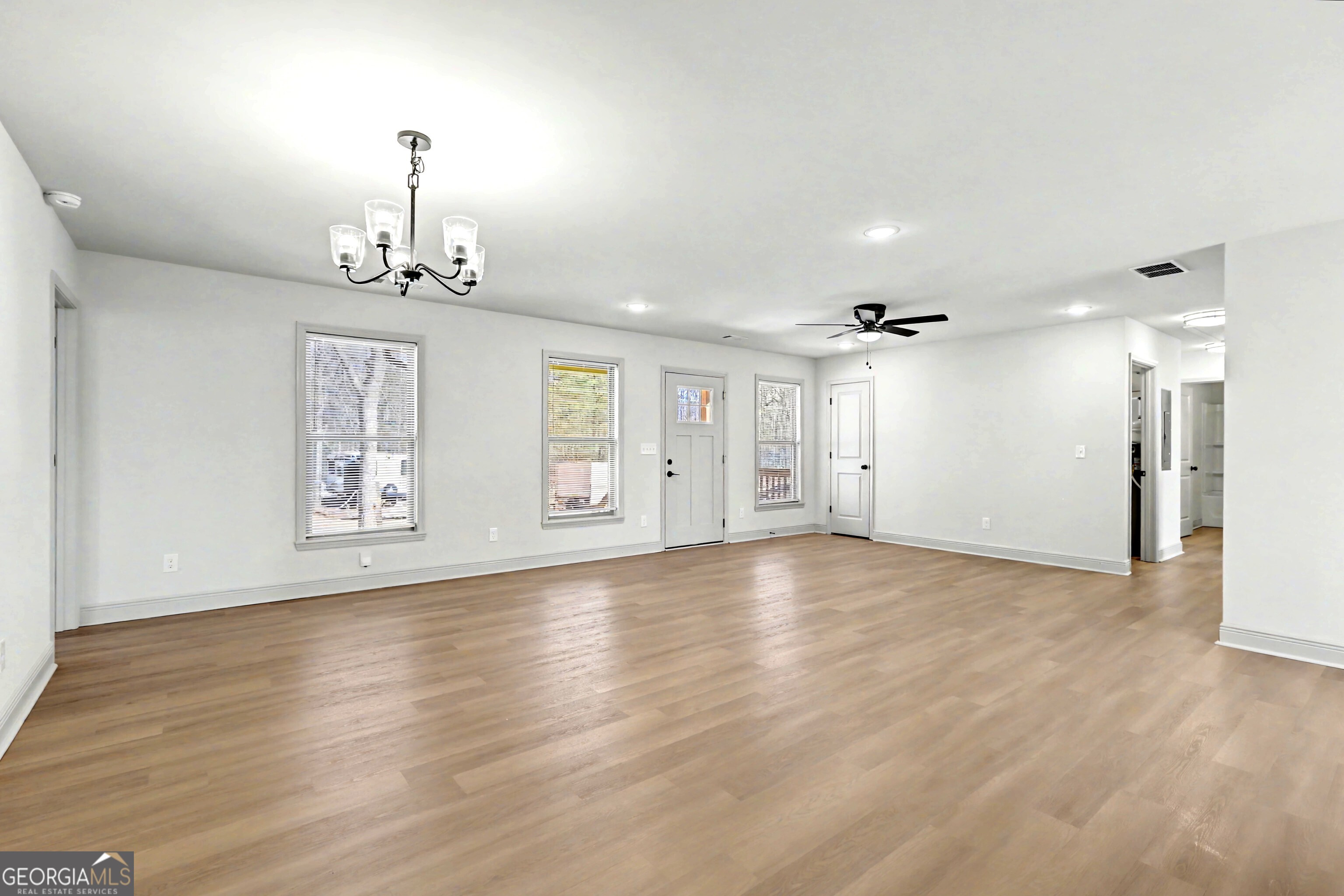 411 Loblolly Ridge Locust Grove, GA 30248 - Photo 5 of 43 a view of empty room with wooden floor