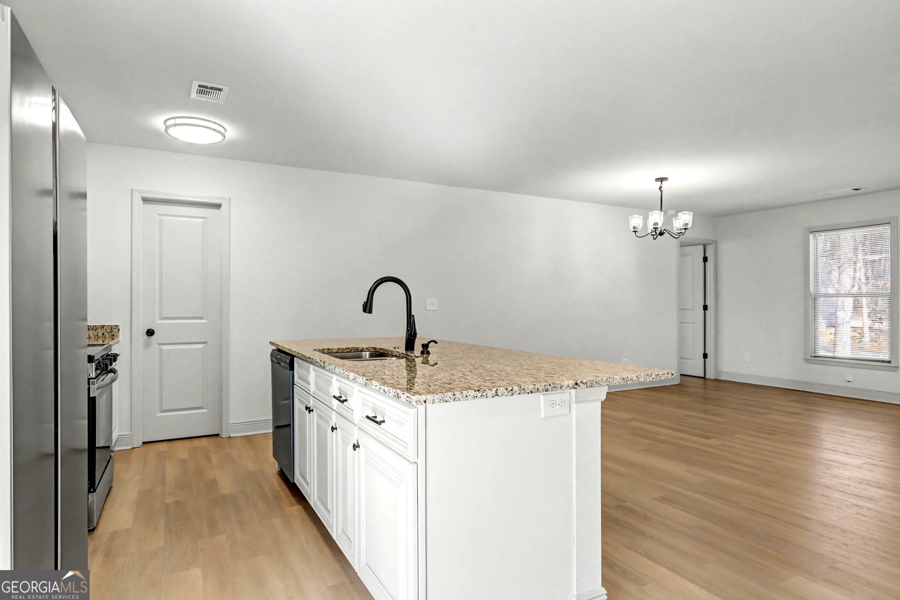 411 Loblolly Ridge Locust Grove, GA 30248 - Photo 8 of 43 a spacious bathroom with a granite countertop sink a mirror and shower
