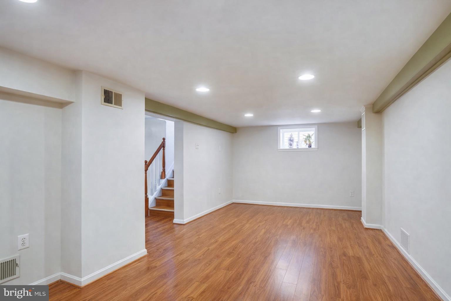 12304 Charles Road Silver Spring, MD 20906 - Photo 11 of 14 a view of empty room with wooden floor