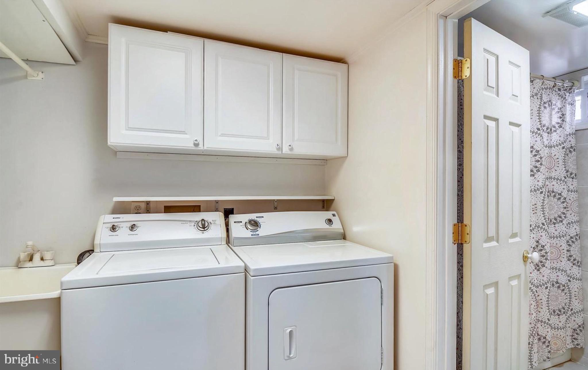 12304 Charles Road Silver Spring, MD 20906 - Photo 12 of 14 a utility room with dryer and washer