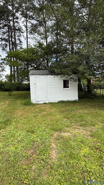 9014 Weldon Drive Henrico, VA 23229 - Photo 22 of 24 a view of a swimming pool with an outdoor seating and a forest