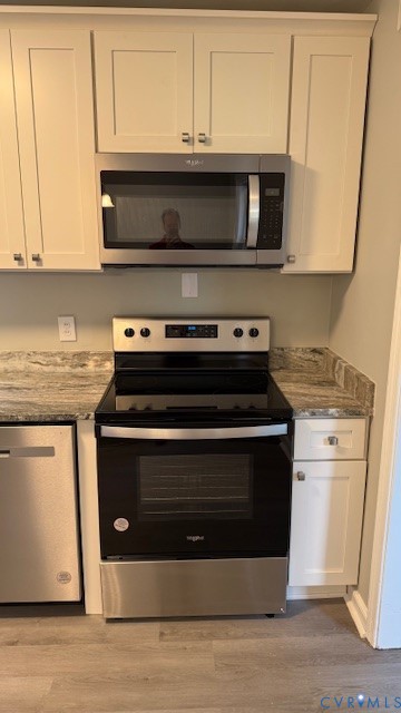 9014 Weldon Drive Henrico, VA 23229 - Photo 4 of 24 a stove top oven sitting inside of a kitchen