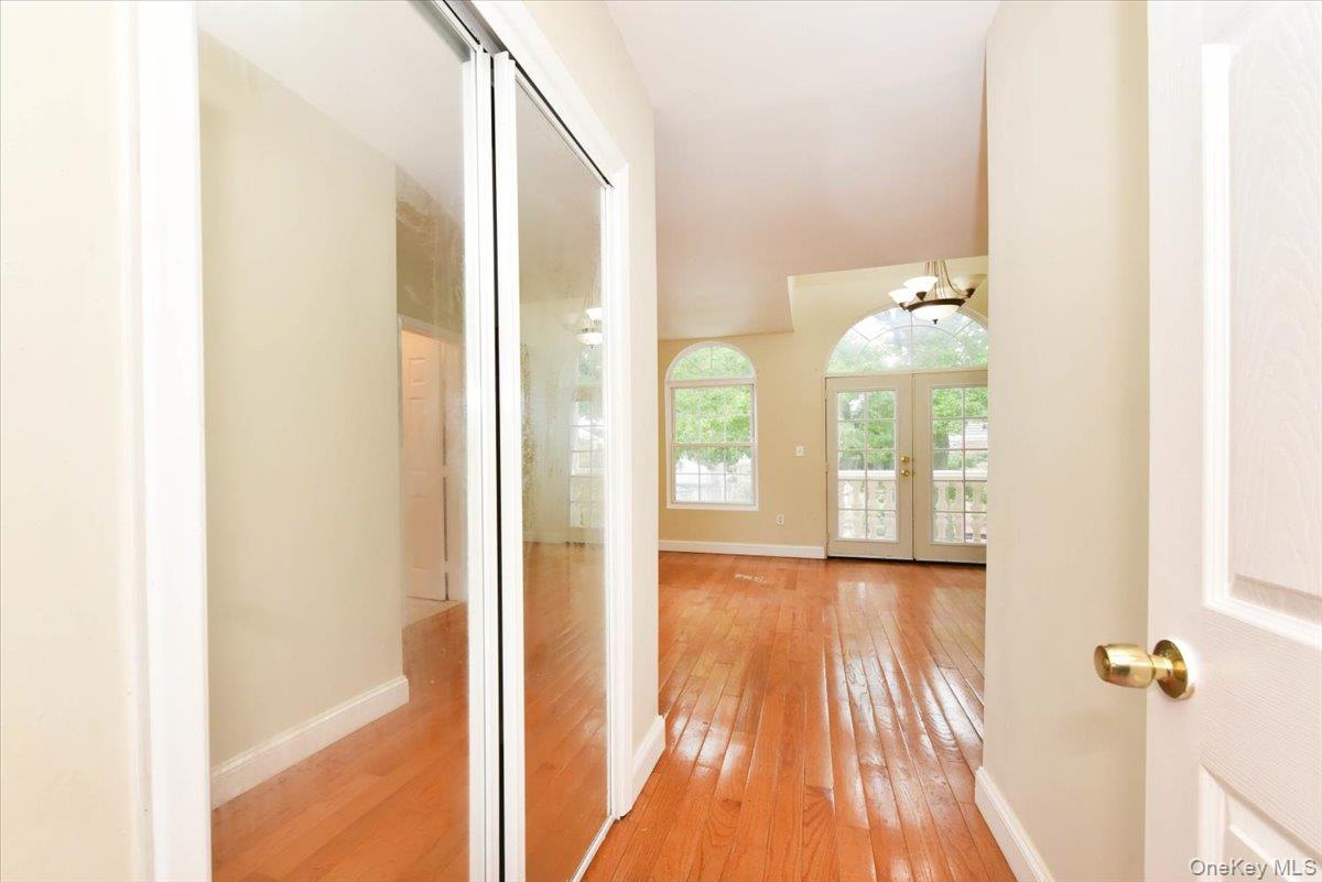 81-35 166th Street Queens, NY 11432 - Photo 21 of 34 a view of a room with wooden floor and windows