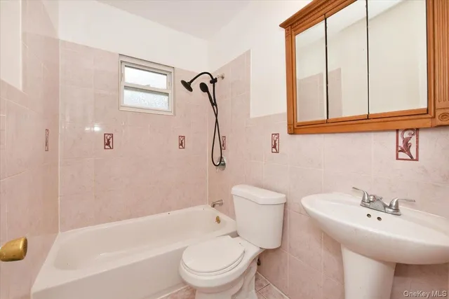 a bathroom with a sink a toilet and a bathtub