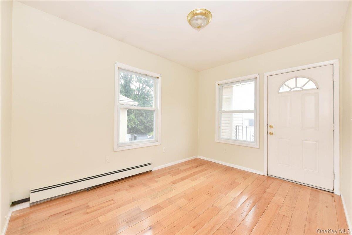 81-35 166th Street Queens, NY 11432 - Photo 23 of 34 an empty room with a window