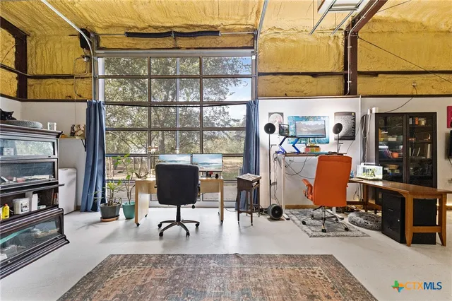 a patio with yard glass top table and chairs