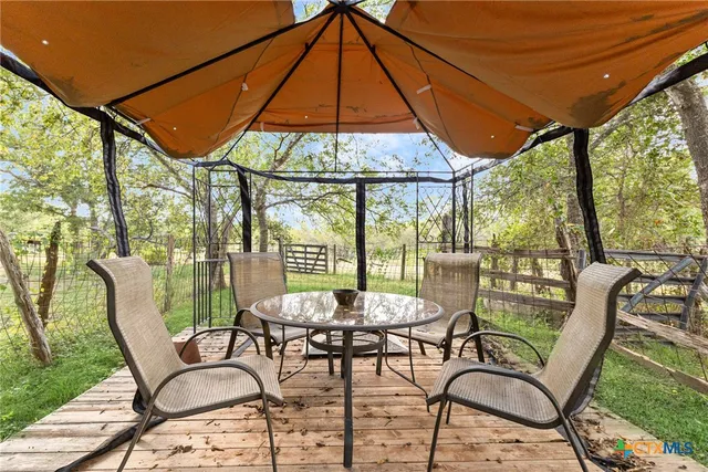 a view of a park with large trees