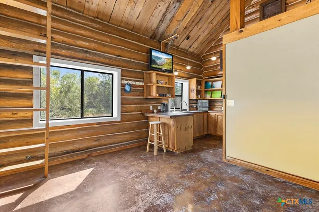 a kitchen with a sink cabinets and appliances