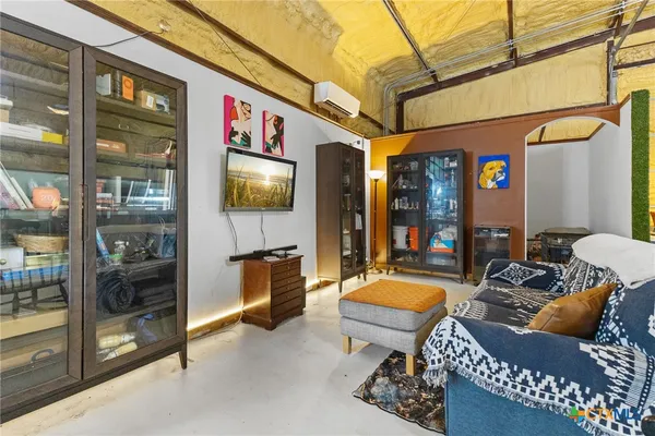 a outdoor living space with furniture and a ceiling fan