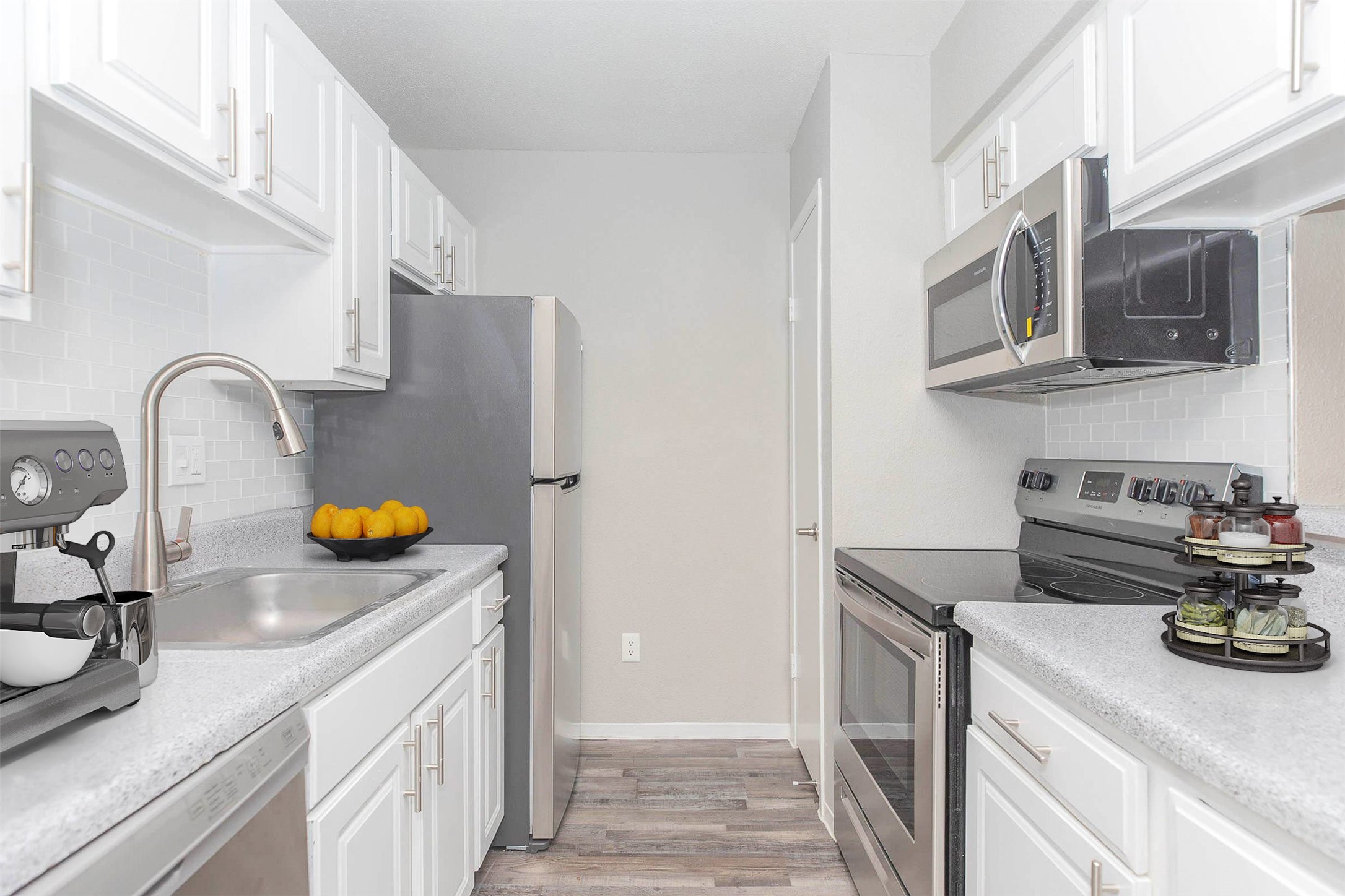 21717 Inverness Forest Boulevard, Unit 2604 Houston, TX 77073 - Photo 2 of 29 a kitchen with stainless steel appliances granite countertop a sink stove and refrigerator