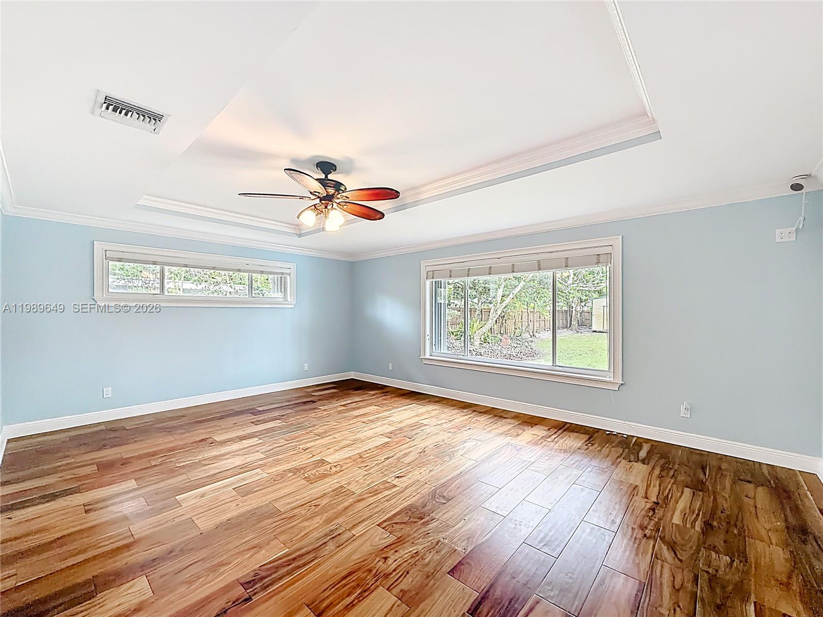 4330 Southwest 7th Street Plantation, FL 33317 - Photo 23 of 57 a view of an empty room with wooden floor and a window