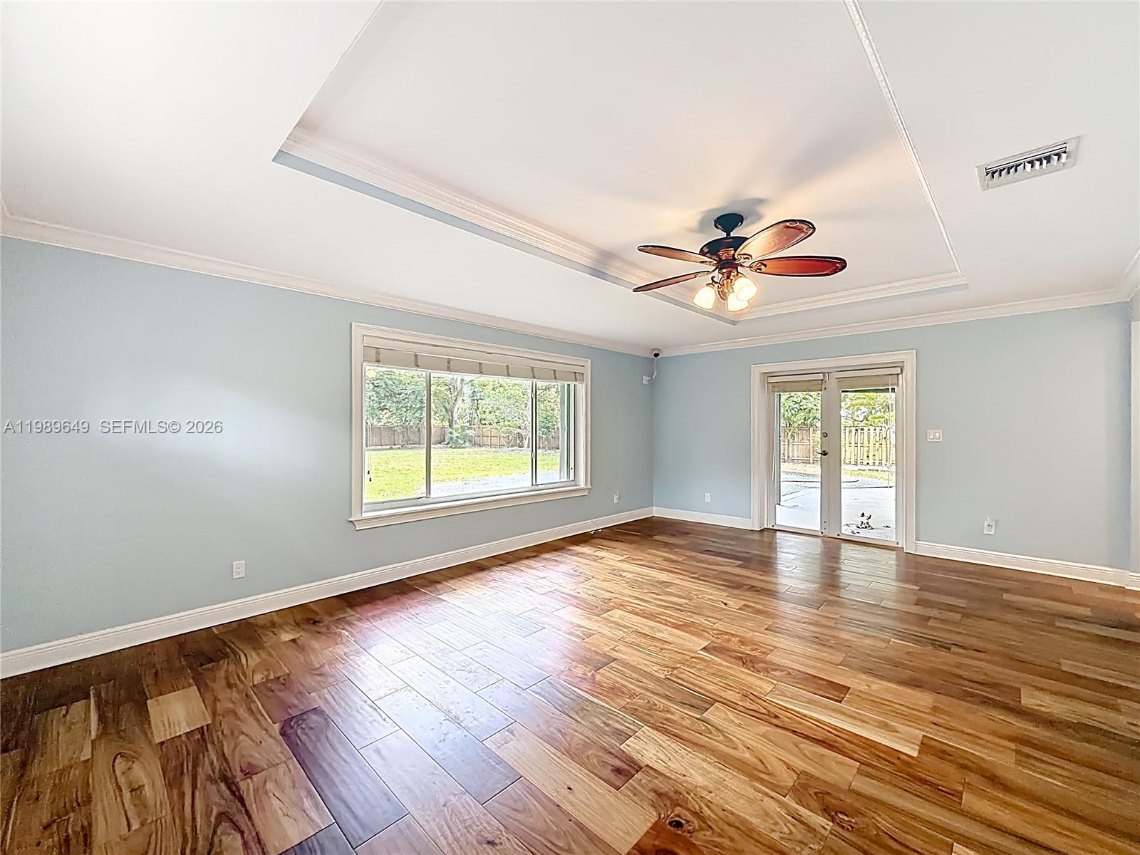4330 Southwest 7th Street Plantation, FL 33317 - Photo 24 of 57 a view of an empty room with wooden floor and a window