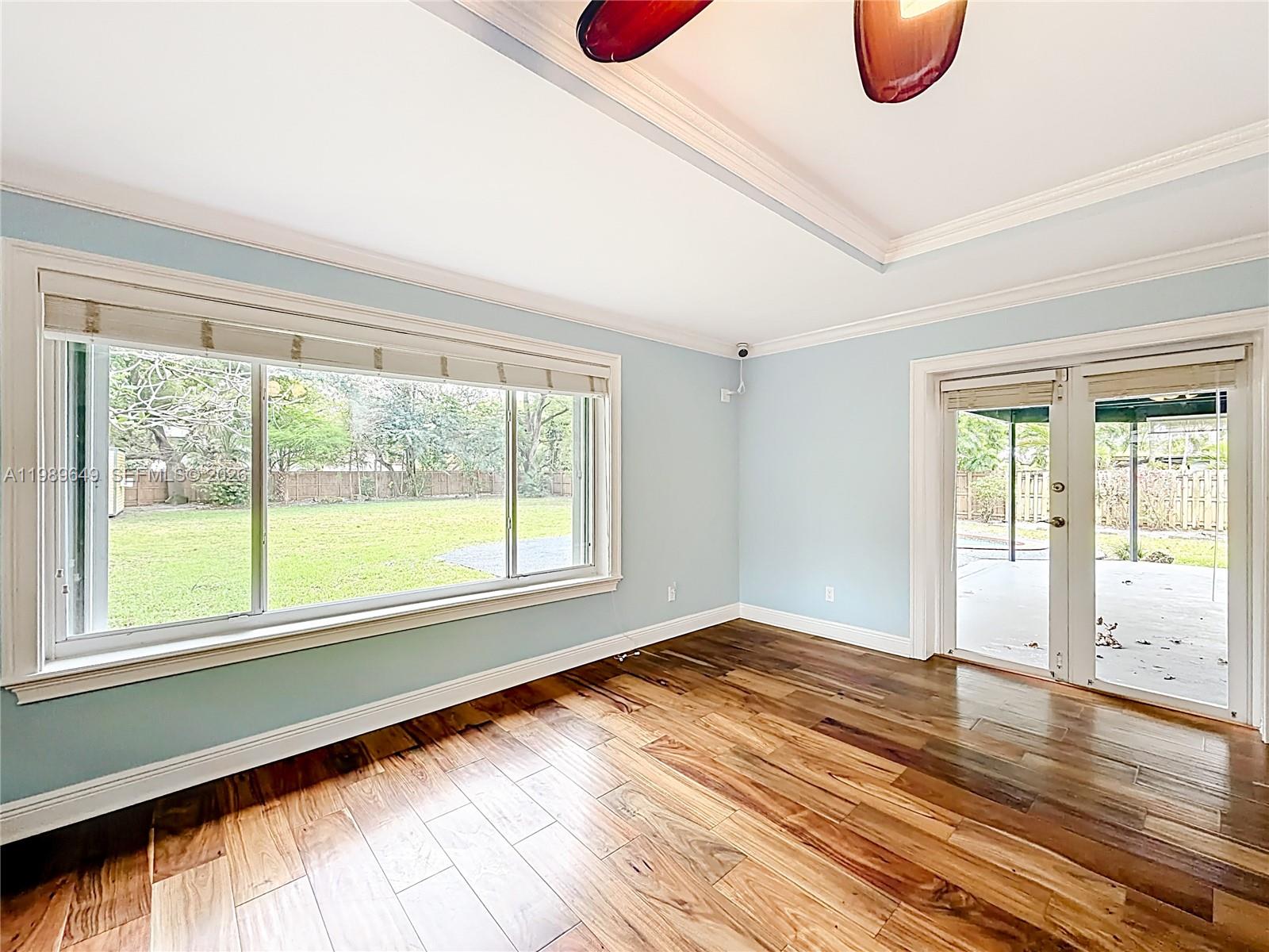 4330 Southwest 7th Street Plantation, FL 33317 - Photo 25 of 57 a view of an empty room with wooden floor and a window