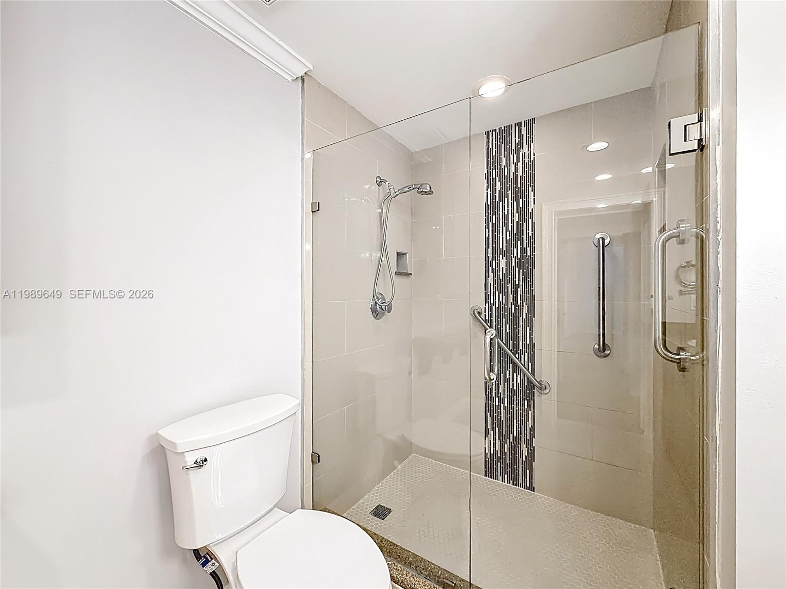 4330 Southwest 7th Street Plantation, FL 33317 - Photo 30 of 57 a bathroom with a shower a toilet and sink