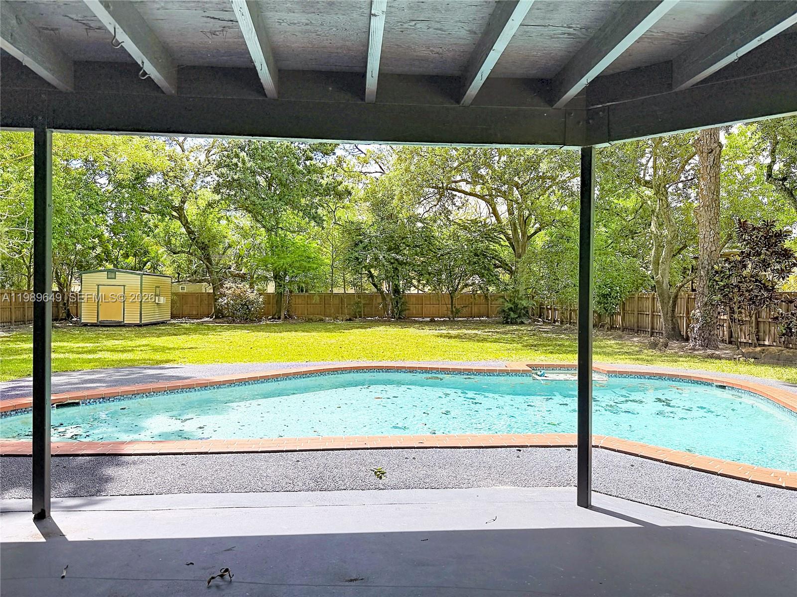 4330 Southwest 7th Street Plantation, FL 33317 - Photo 47 of 57 a view of swimming pool and yard