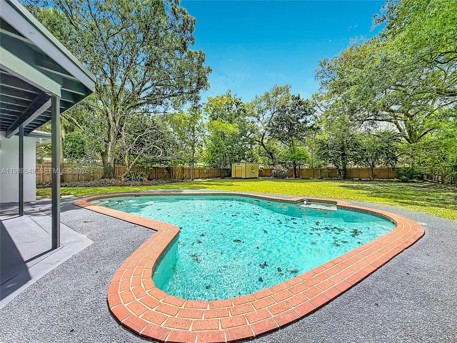 4330 Southwest 7th Street Plantation, FL 33317 - Photo 48 of 57 a view of a swimming pool with a patio