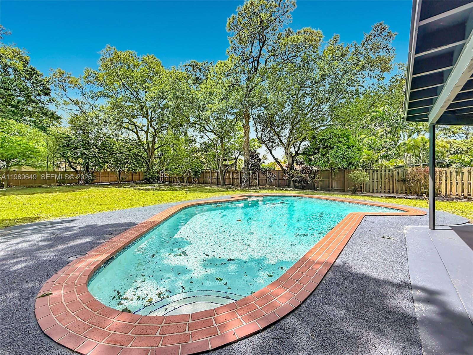 4330 Southwest 7th Street Plantation, FL 33317 - Photo 49 of 57 a view of swimming pool with a yard
