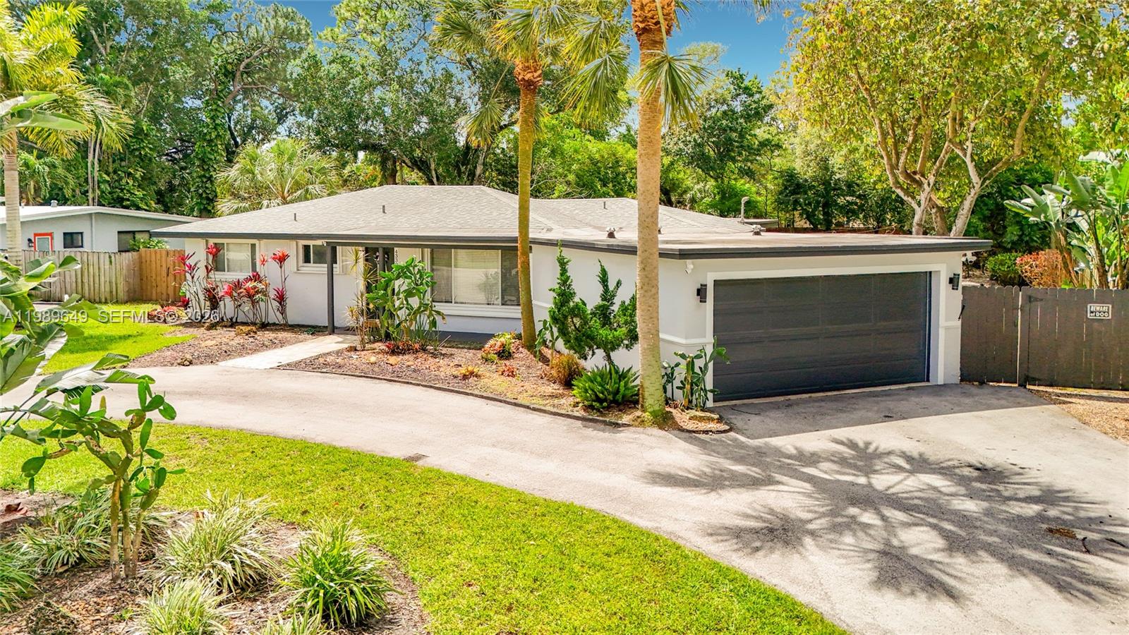 4330 Southwest 7th Street Plantation, FL 33317 - Photo 5 of 57 a front view of a house with garden