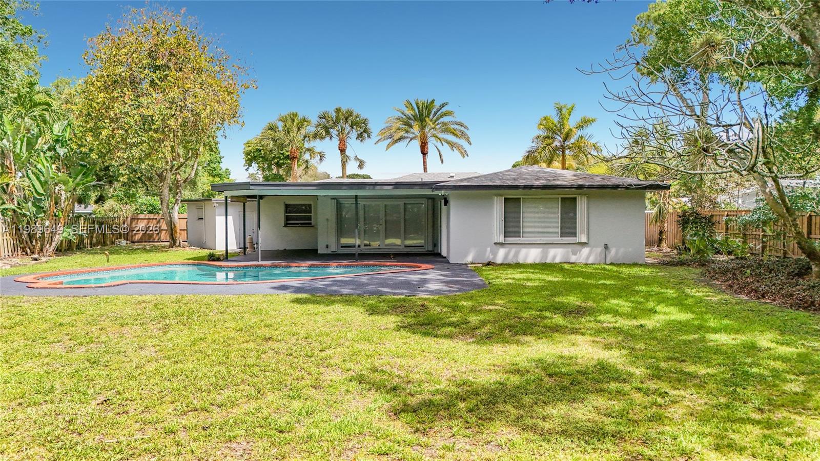 4330 Southwest 7th Street Plantation, FL 33317 - Photo 56 of 57 a view of house with swimming pool outdoor seating