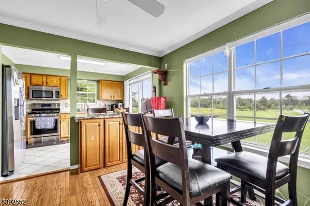 a view of a dining room with furniture window and outside view