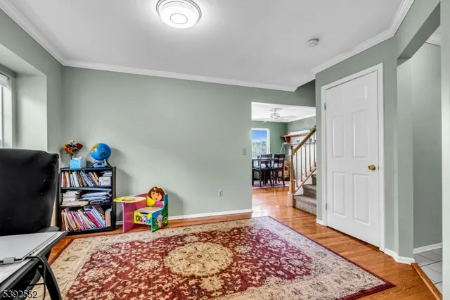 a bedroom with furniture and wooden floor