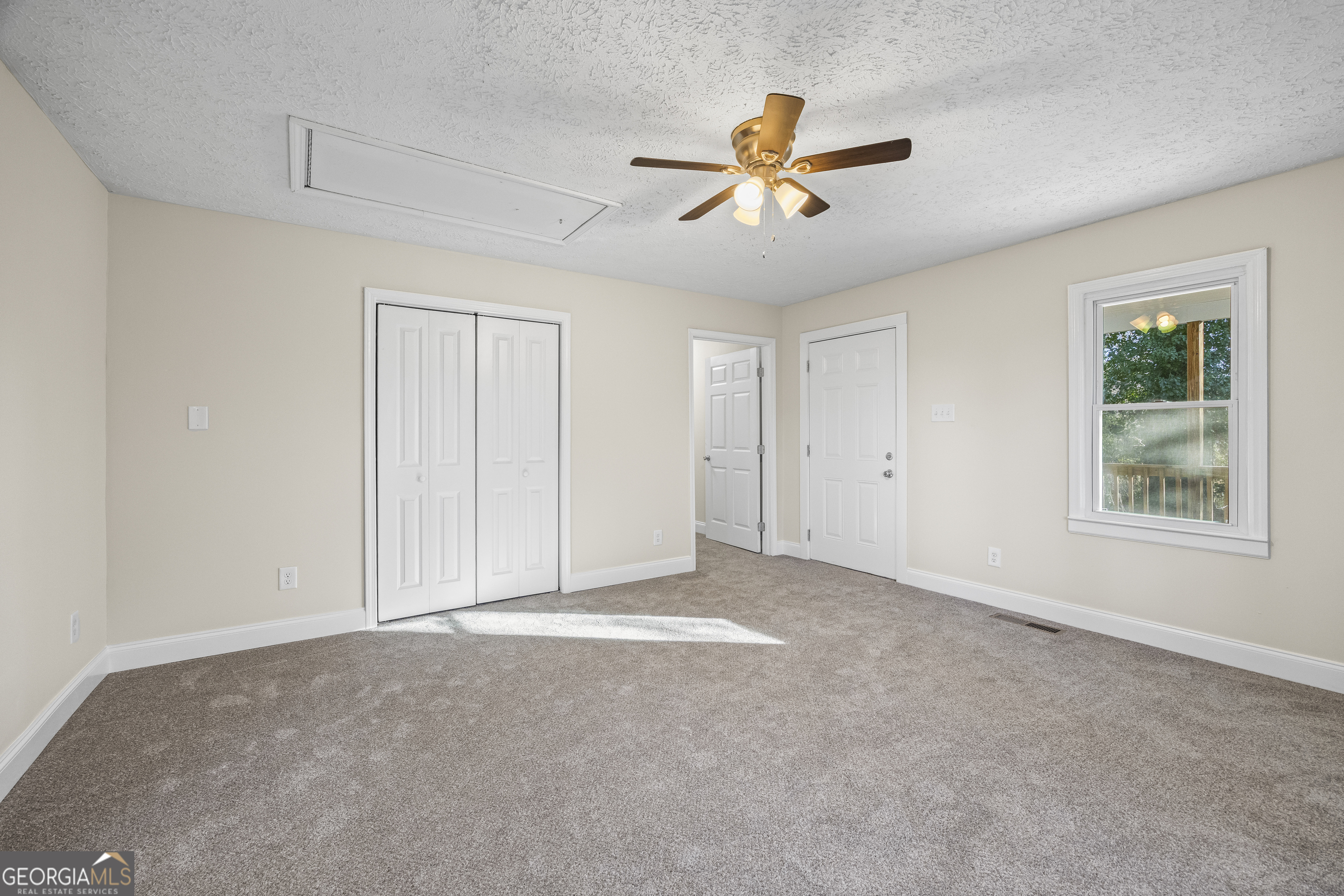 9750 Lavonia Road Carnesville, GA 30521 - Photo 25 of 49 a view of a livingroom with a ceiling fan and window