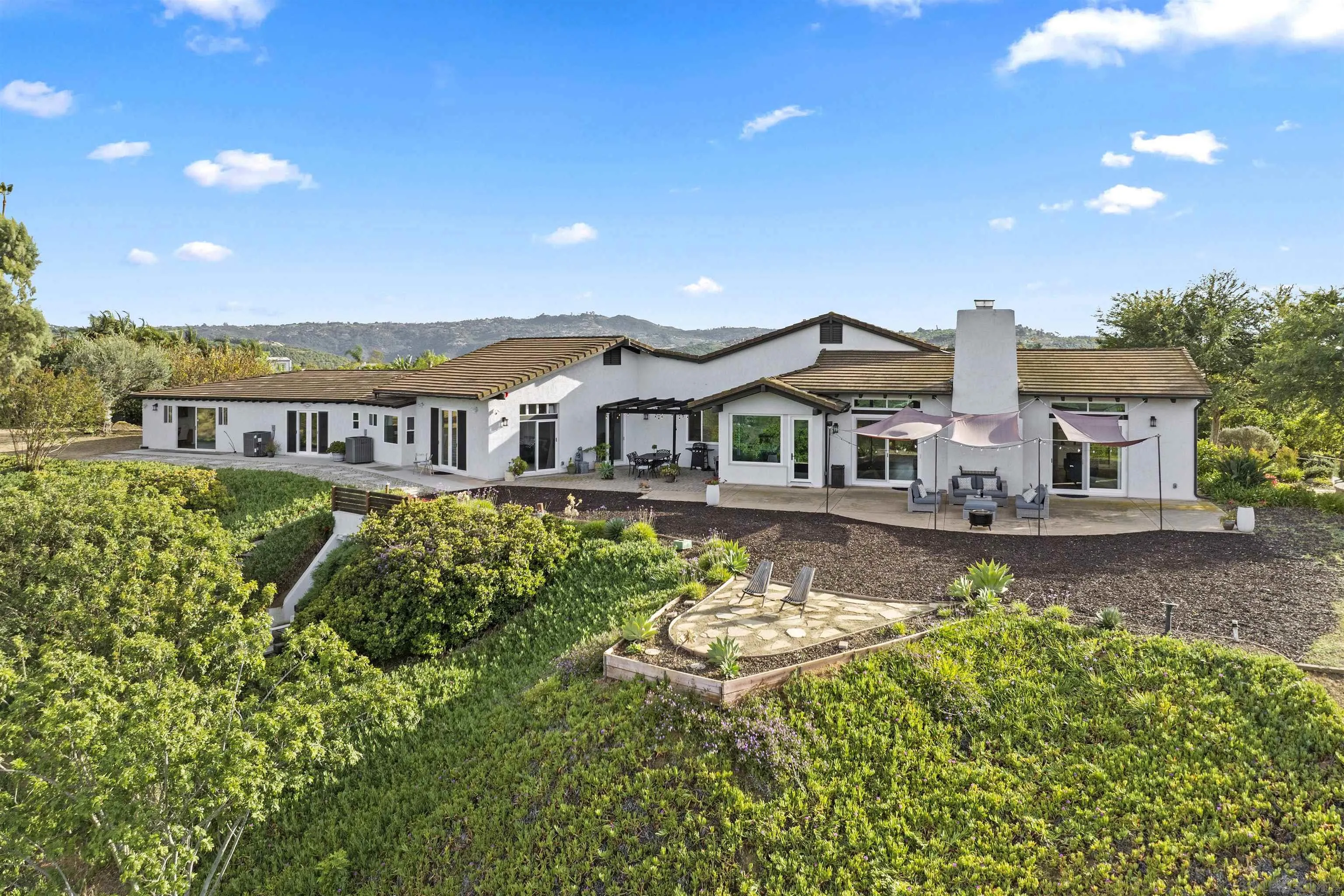 30659 Diaz Road Valley Center, CA 92082 - Photo 2 of 44 a house with swimming pool in front of it