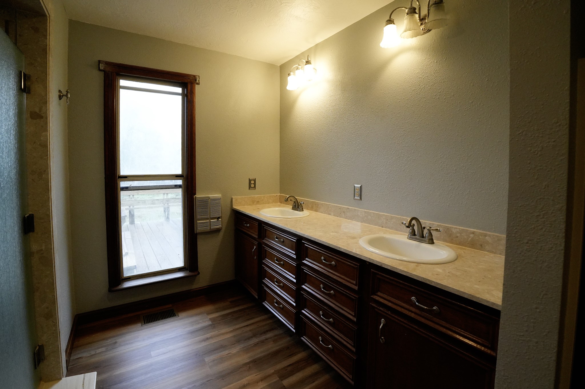 4731 Krischke Road Schulenburg, TX 78956 - Photo 29 of 40 a bathroom with a double vanity sink and a mirror