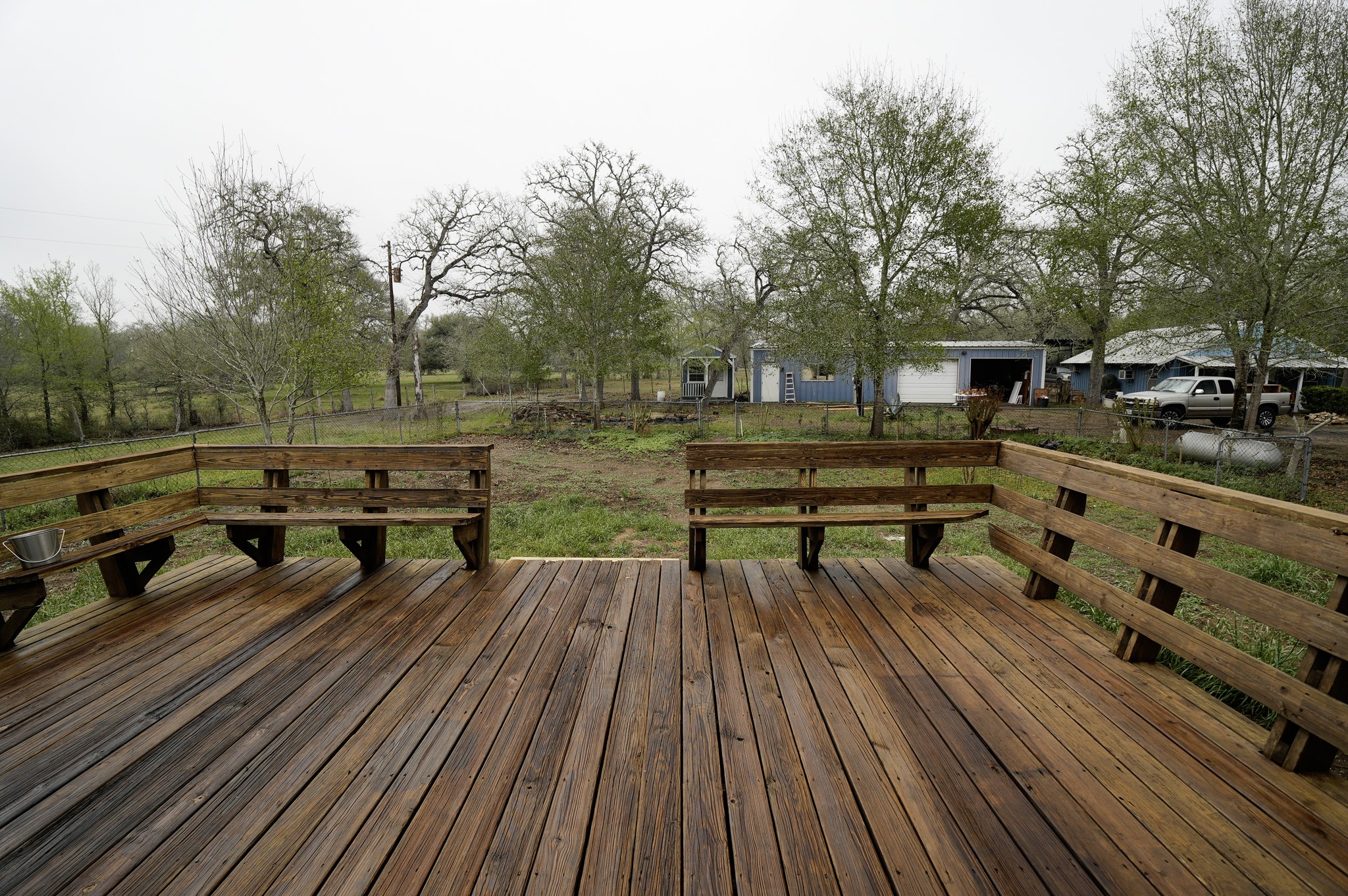 4731 Krischke Road Schulenburg, TX 78956 - Photo 33 of 40 a park bench sitting on top of a wooden floor
