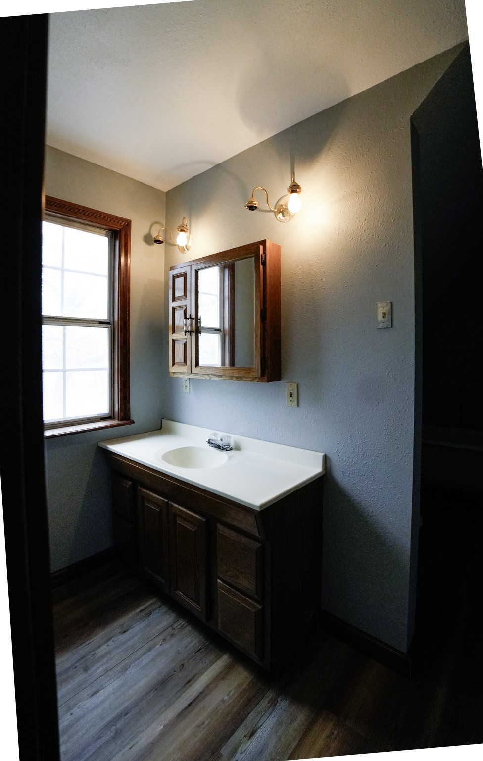 4731 Krischke Road Schulenburg, TX 78956 - Photo 34 of 40 a bathroom with a sink and a mirror