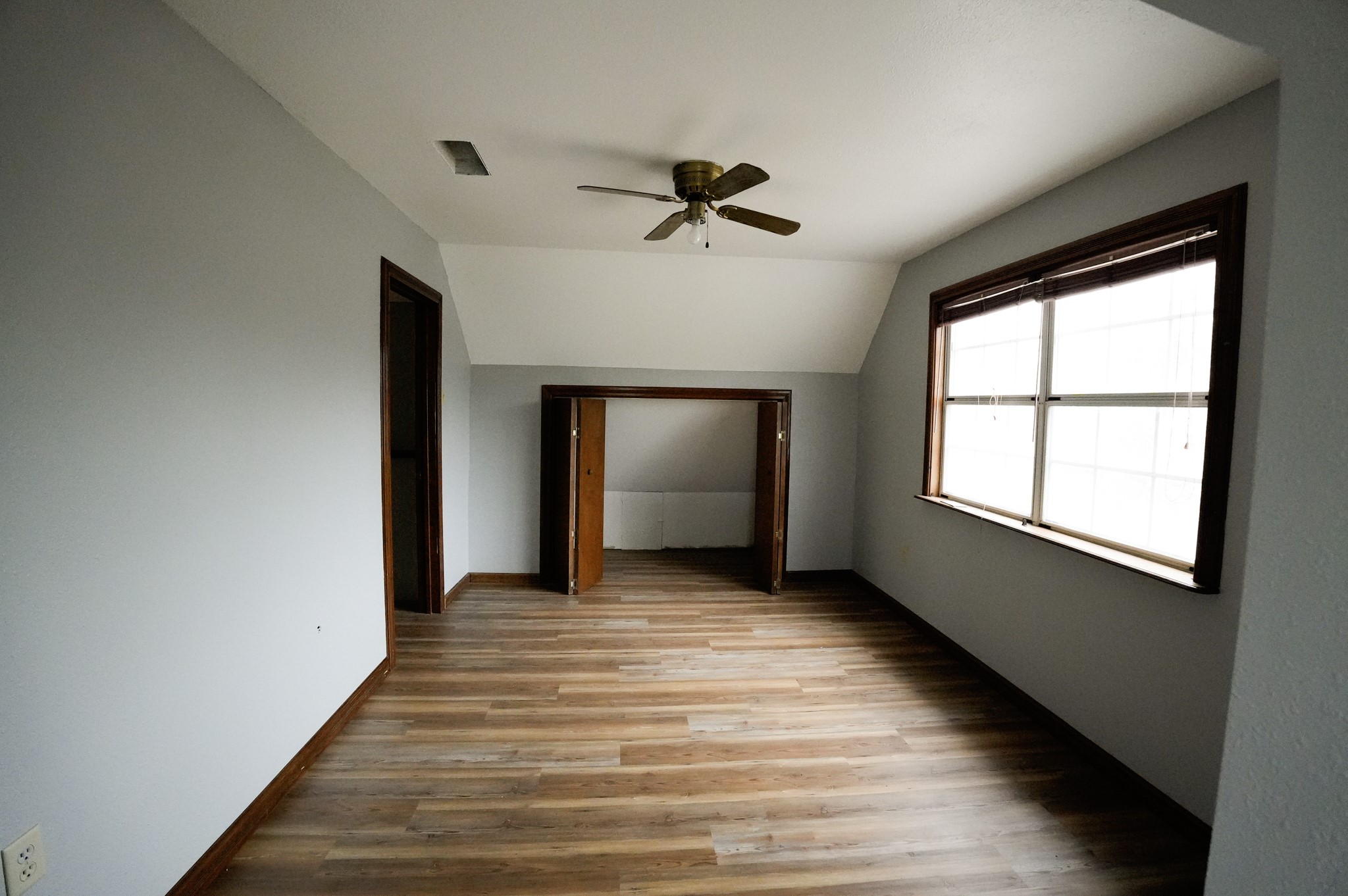 4731 Krischke Road Schulenburg, TX 78956 - Photo 37 of 40 wooden floor in an empty room with a window