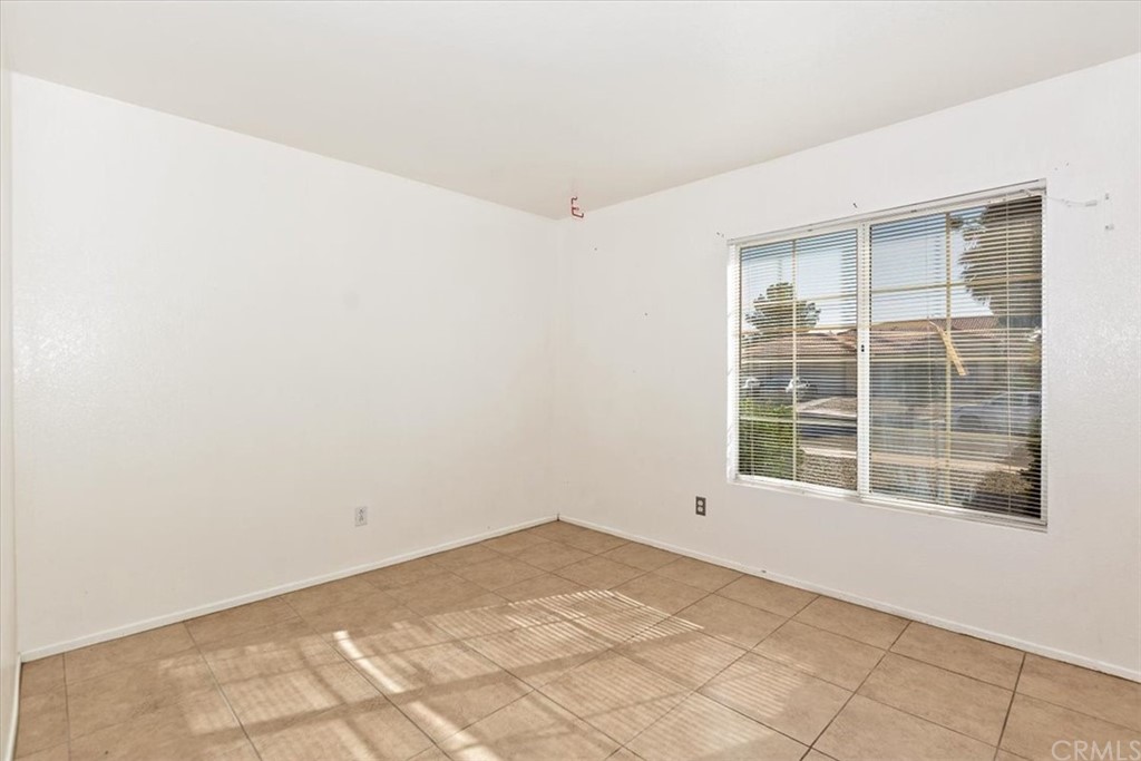 14560 Juniper Lane Adelanto, CA 92301 - Photo 12 of 25 a view of empty room with windows