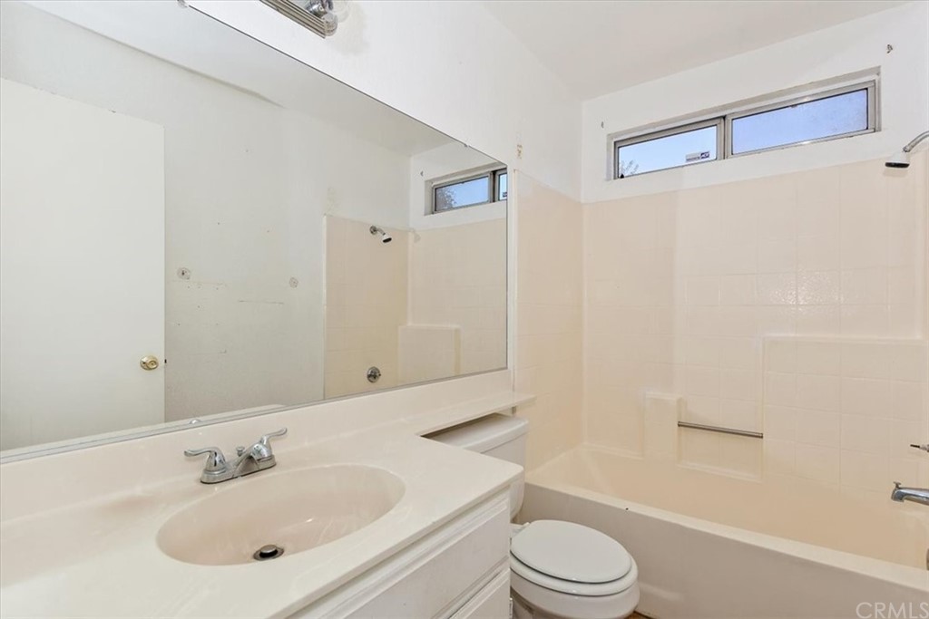14560 Juniper Lane Adelanto, CA 92301 - Photo 13 of 25 a bathroom with a sink toilet and shower