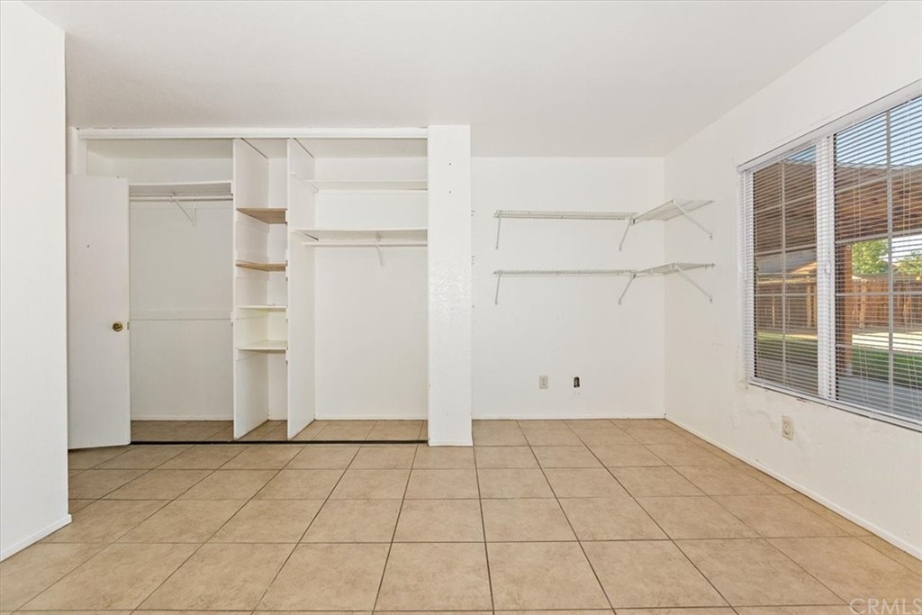 14560 Juniper Lane Adelanto, CA 92301 - Photo 16 of 25 an empty room with windows