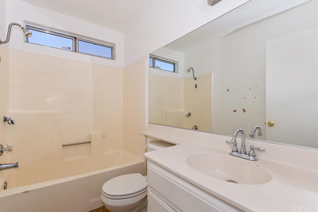 14560 Juniper Lane Adelanto, CA 92301 - Photo 17 of 25 a bathroom with a sink a toilet and shower