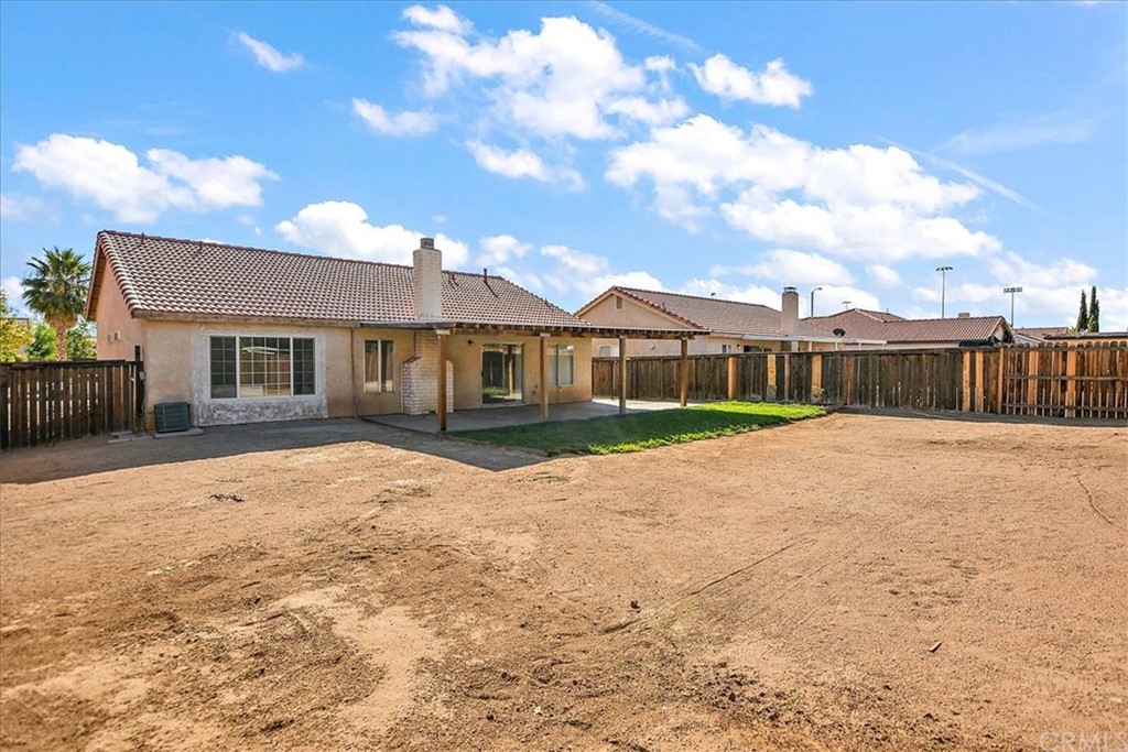 14560 Juniper Lane Adelanto, CA 92301 - Photo 24 of 25 a front view of a house with a yard