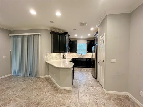 a large bathroom with a sink and a large mirror