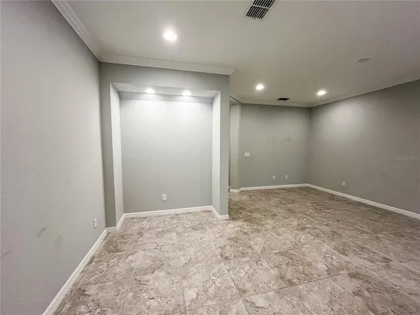 an empty room with a natural light